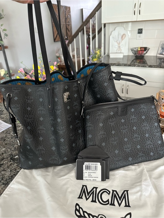 MCM Handbags - MCM Black Visetos Reversible Tote with Blue Interior and Matching Pouch